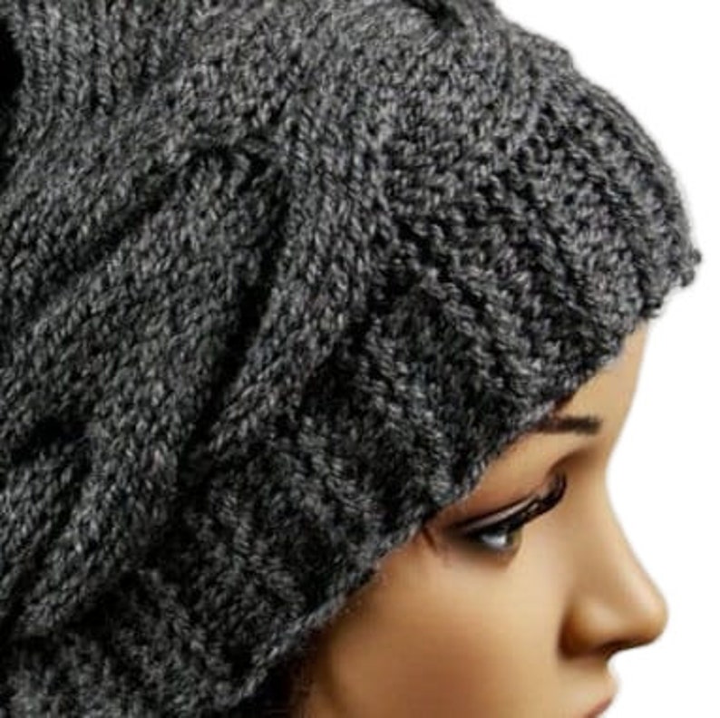 a close up of a mannequin's head wearing a knitted hat