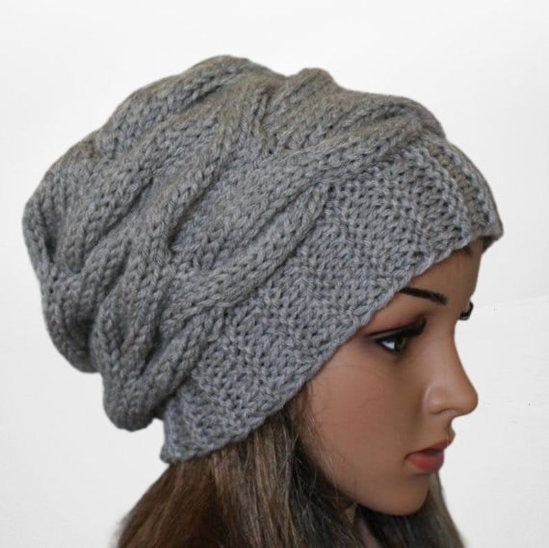 a woman wearing a gray knitted hat