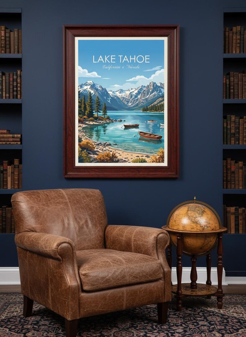 May include: A framed print of Lake Tahoe, California & Nevada, with a serene lake scene, mountains, and boats. The print hangs above a leather armchair and a globe on a wooden stand, set against a dark blue wall.