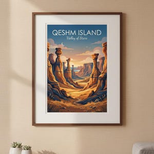 May include: A framed art print featuring a landscape illustration of Qeshm Island Valley of Stars. The image displays tall, weathered rock formations in shades of orange and brown under a blue sky with clouds and a crescent moon.