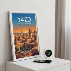 May include: A framed print titled "YAZD Historic Windcatchers" shows a cityscape with traditional architecture under a sunset sky. A small digital clock displays 7:30, and a smartphone rests on a white bedside table.