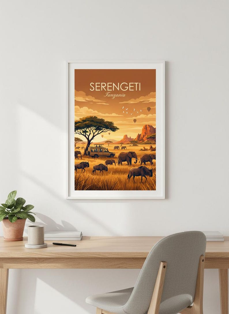 May include: Framed art print featuring a Serengeti landscape with elephants, zebras, and a safari vehicle. The artwork has a warm color palette with the text "SERENGETI Tanzania" at the top. The scene includes hot air balloons and a large tree.