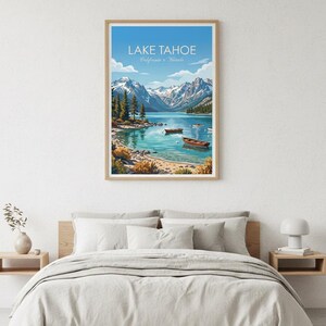 May include: A framed art print of Lake Tahoe, California, featuring a serene lake scene with boats, mountains, and trees under a blue sky. The print is displayed above a bed with neutral-colored bedding.