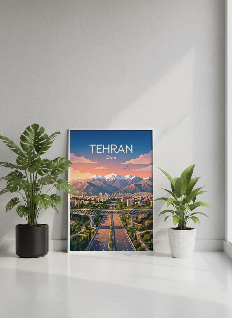 May include: A framed art print featuring a scenic view of Tehran, Iran. The artwork depicts a highway, buildings, and mountains under a blue sky with the text "TEHRAN Iran". Two potted plants flank the artwork.