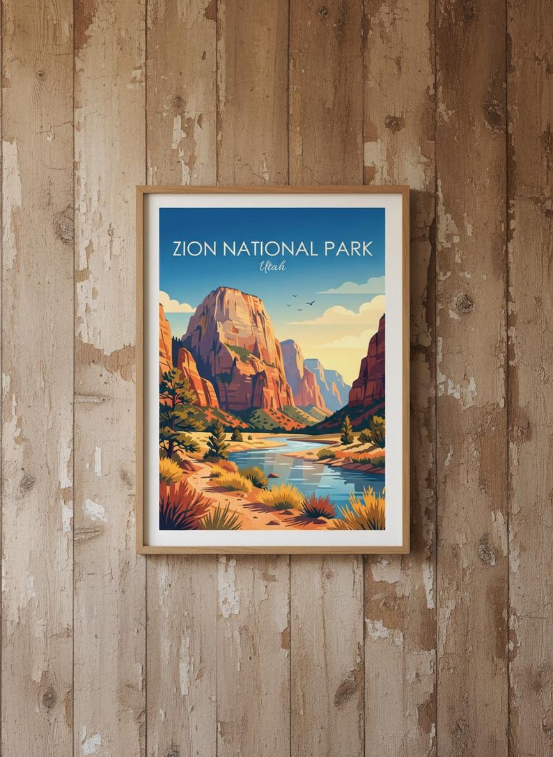 May include: A framed art print featuring a landscape illustration of Zion National Park, Utah. The image displays towering red rock cliffs, a winding blue river, and desert vegetation under a clear sky with the text Zion National Park Utah.