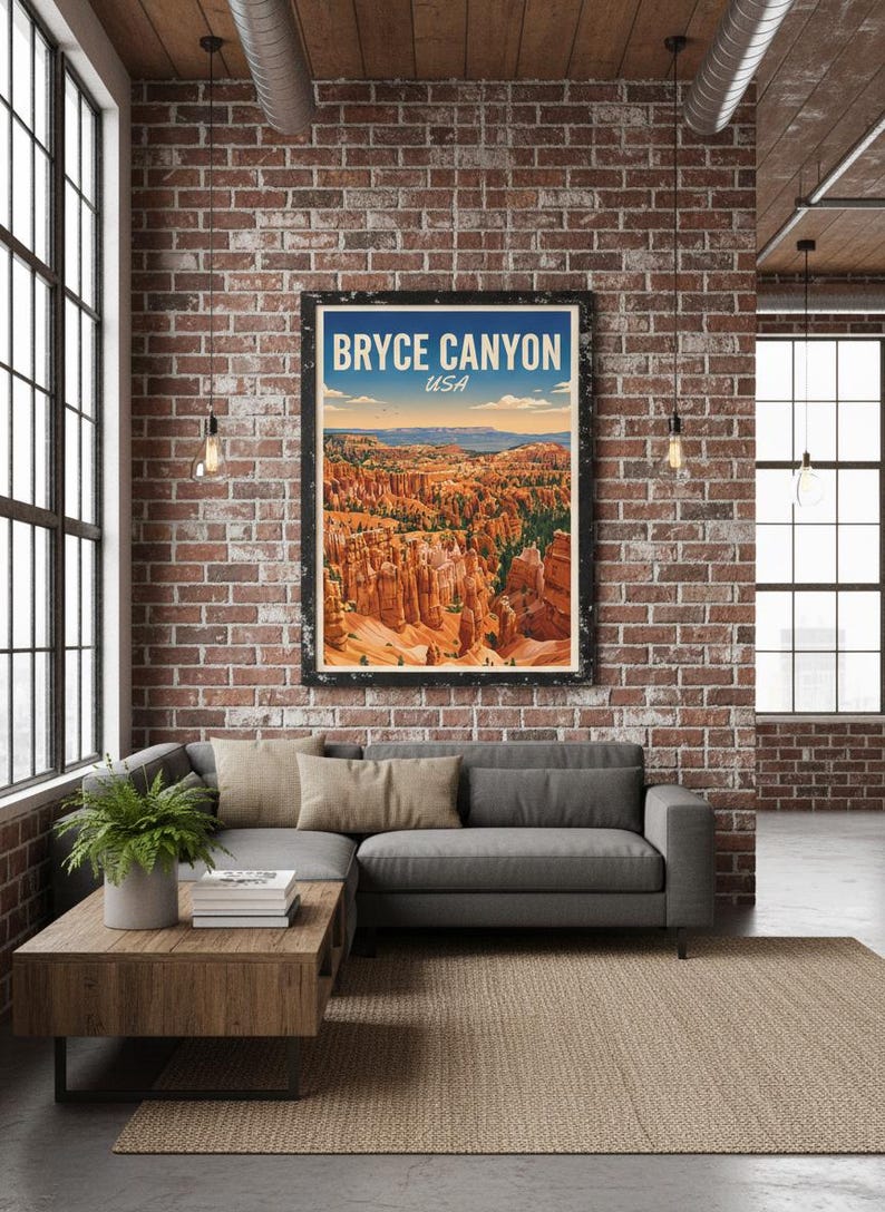 May include: A framed poster with the text "BRYCE CANYON USA" hangs on a brick wall above a gray sectional sofa. The poster depicts a landscape of orange rock formations under a blue sky. A wooden coffee table and a jute rug complete the living room setting.