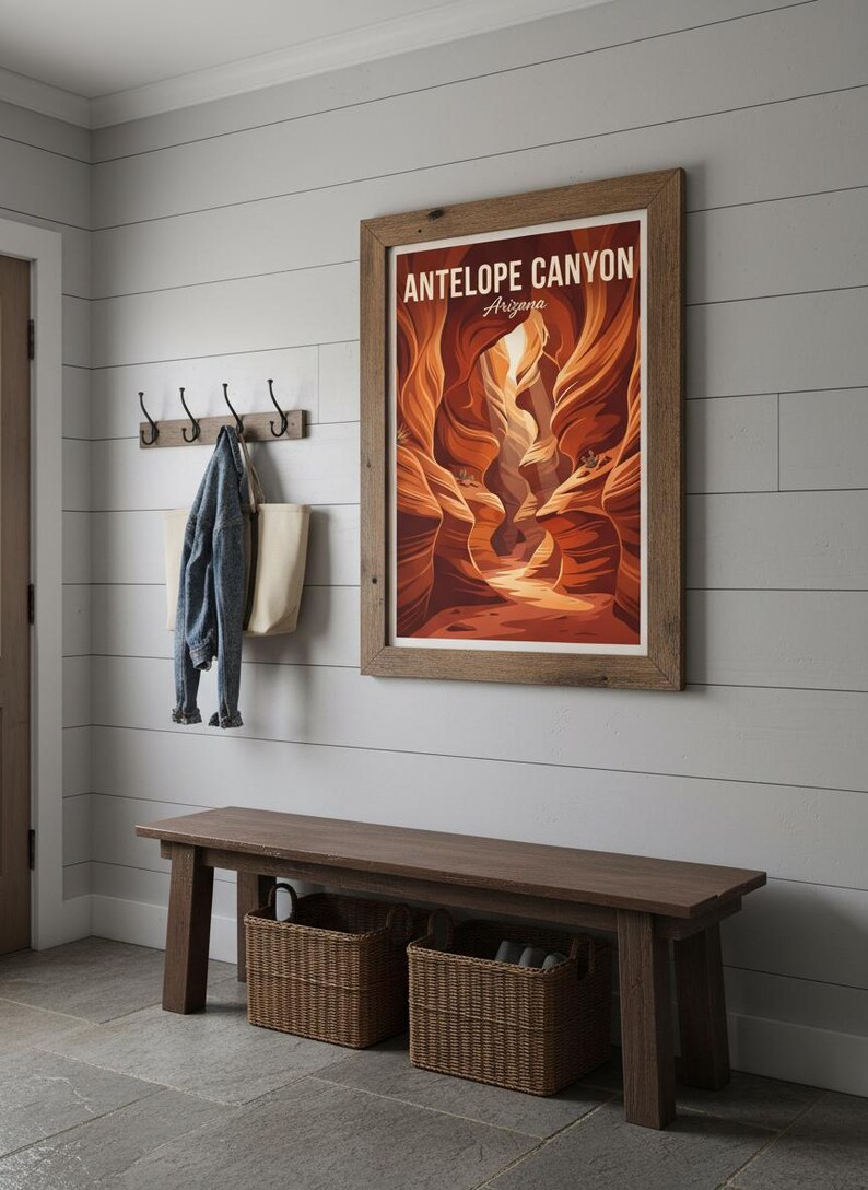 May include: A framed poster of Antelope Canyon, Arizona, hangs on a white paneled wall. Below, a dark wooden bench with two woven baskets sits on a stone floor. A denim jacket and tote bag hang on hooks.