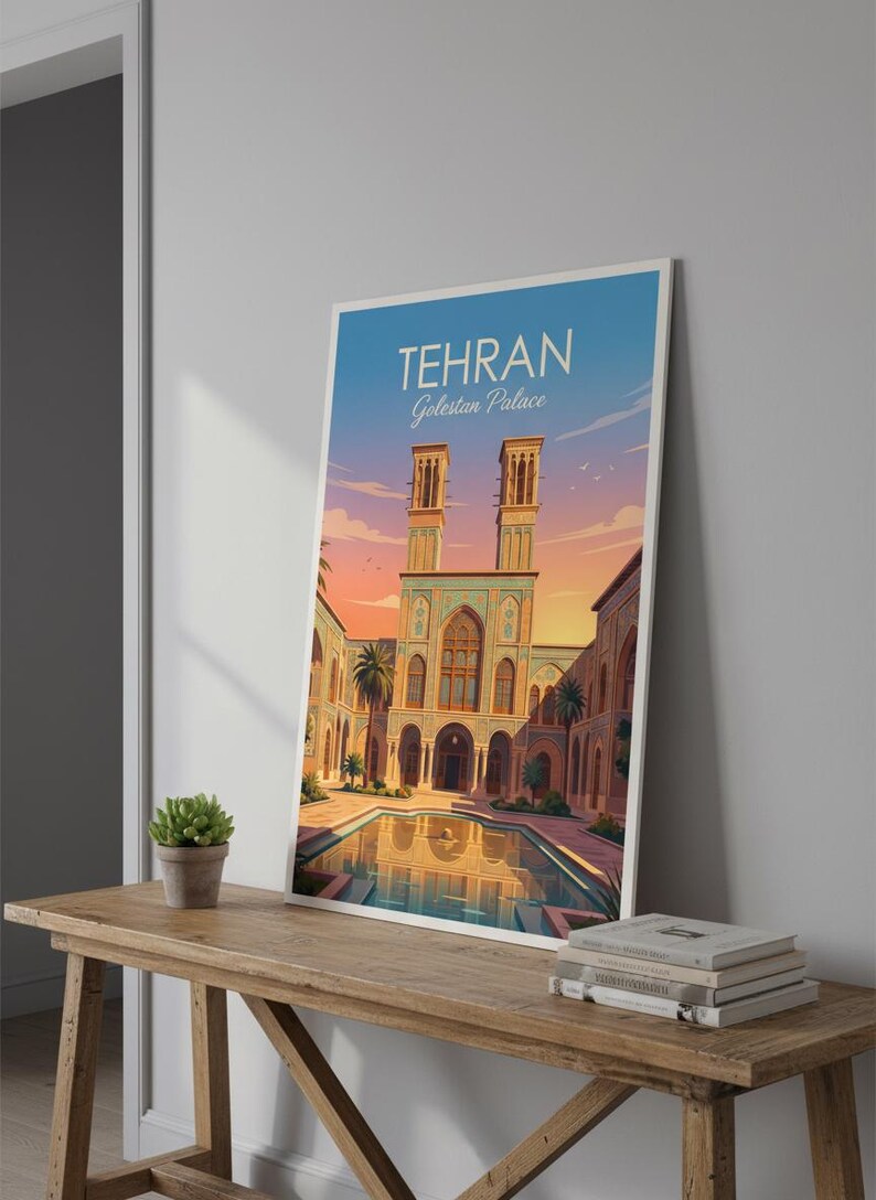 May include: A framed art print featuring a stylized illustration of the Golestan Palace in Tehran, Iran. The artwork depicts the palace with its distinctive architecture, a reflecting pool, and the text "TEHRAN Golestan Palace" at the top.