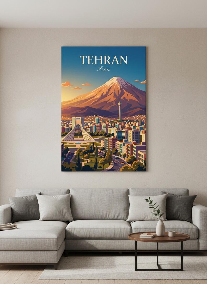 May include: A vibrant art print of Tehran, Iran, featuring a mountain, cityscape, and the Azadi Tower. The artwork has a warm color palette with a blue sky and the text "TEHRAN Iran" at the top. The print is displayed above a gray sectional sofa.