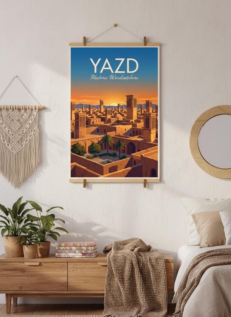 May include: A poster print showing a stylized illustration of Yazd, Iran, with the text "YAZD Historic Windcatchers" in white. The artwork depicts a cityscape with wind towers under a sunset sky, in shades of orange, blue, and brown.