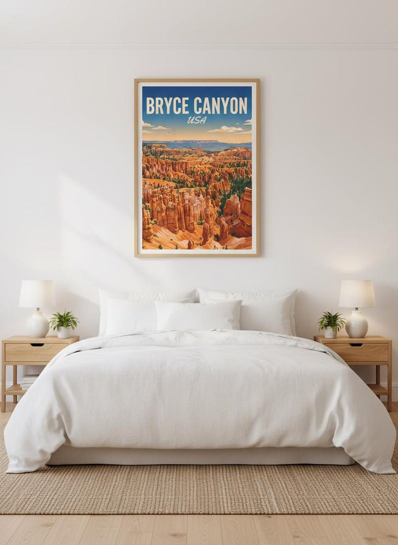 May include: A framed print of Bryce Canyon National Park in Utah, USA, hangs above a bed. The artwork features a landscape of orange rock formations under a blue sky. The print is in a light wood frame.
