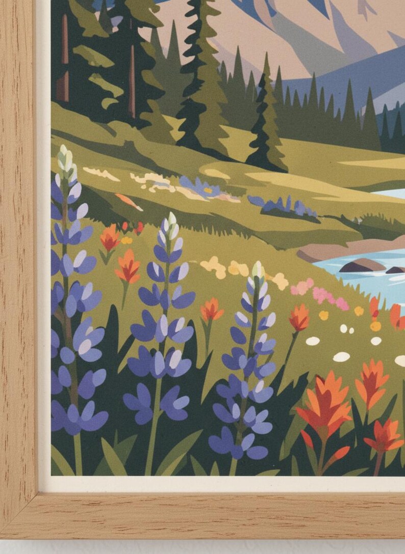 May include: A framed art print featuring a colorful landscape scene. The artwork depicts a mountain range, a river, and a field of wildflowers in shades of blue, orange, and pink. The frame is made of light-colored wood.