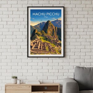 May include: A framed wall art print featuring a colorful illustration of the Machu Picchu ruins in Peru. The artwork displays stone structures, green terraces, and towering mountains under a blue sky with the text Machu Picchu Peru.