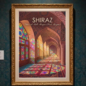 May include: A framed art print featuring the interior of the Nasir al-Mulk Mosque in Shiraz, Iran. The image displays colourful stained glass windows casting vibrant light patterns onto the floor, set within an ornate gold-coloured frame.