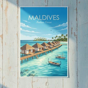 May include: A poster featuring a scenic view of the Maldives. The image shows several bungalows on stilts over turquoise water, with boats and palm trees. The sky is a bright blue with the text "MALDIVES Indian Ocean".