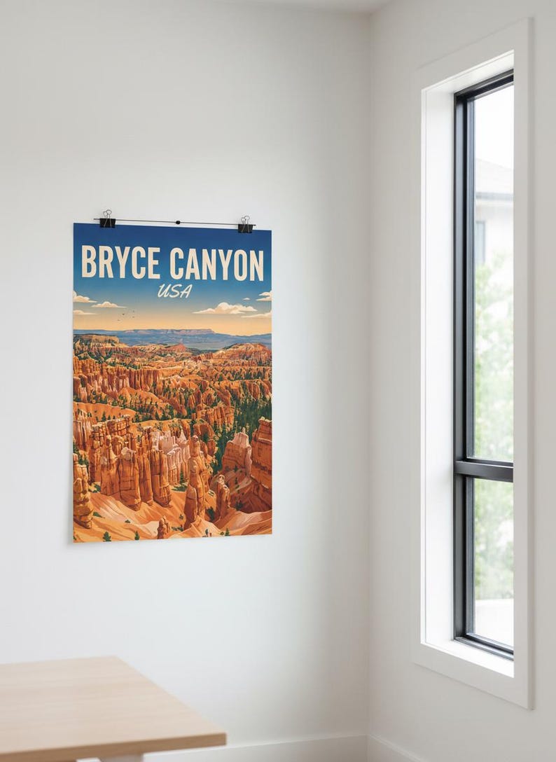 May include: Bryce Canyon USA poster print. The poster features a scenic view of the canyon with orange rock formations under a blue sky. The poster is held in place by two black clips.