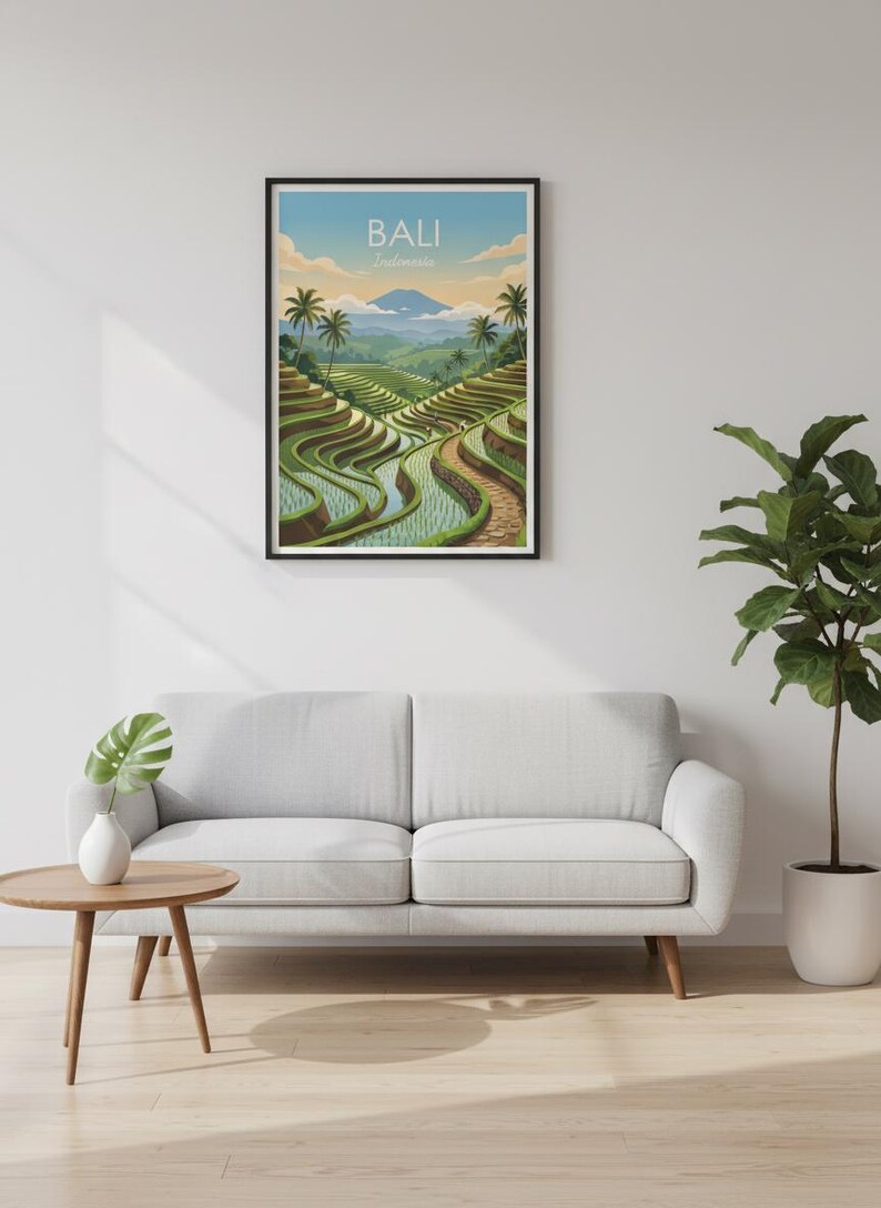 May include: A framed wall art print featuring a landscape illustration of Bali, Indonesia, with green terraced rice fields, palm trees, and a distant mountain under a soft sky. The text BALI Indonesia is printed at the top of the artwork.