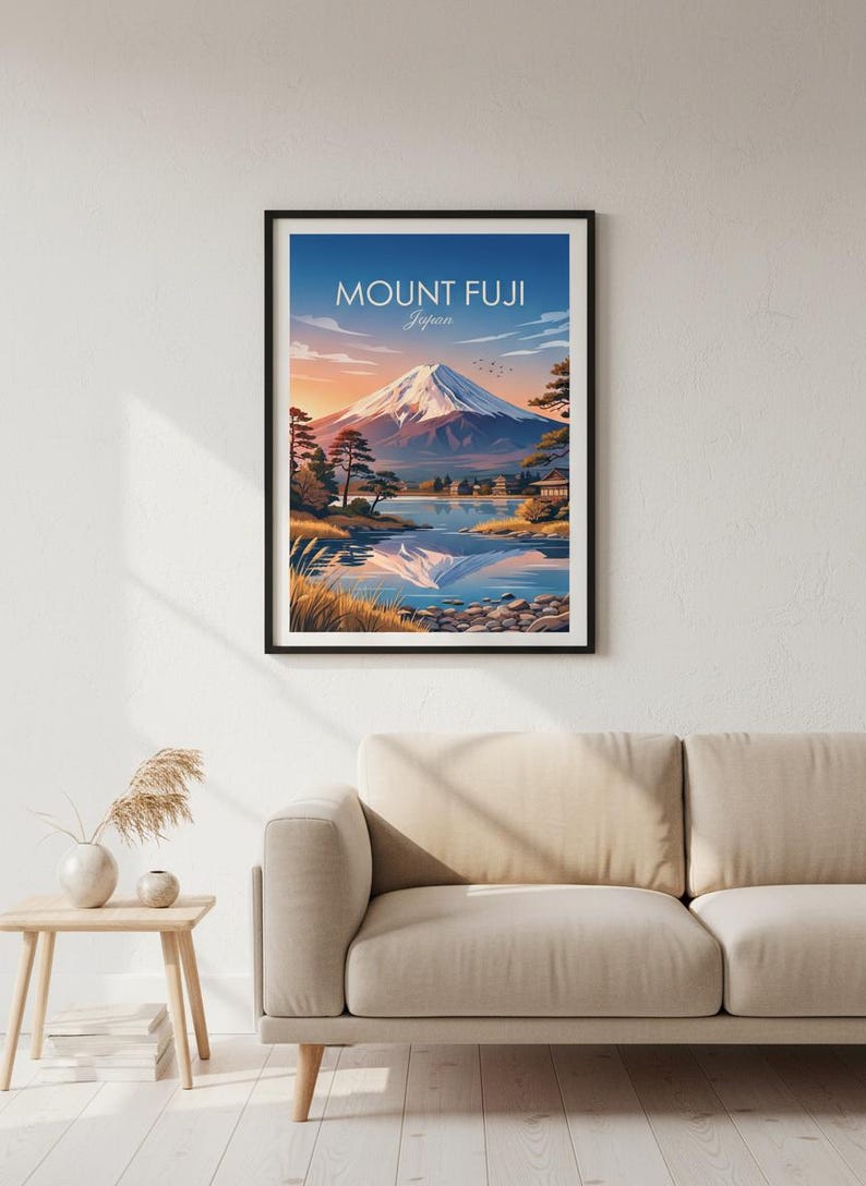 May include: Framed art print featuring Mount Fuji in Japan. The artwork depicts the iconic mountain with a snow-capped peak, reflected in a serene lake. The sky transitions from blue to orange, with the text "MOUNT FUJI Japan" at the top.