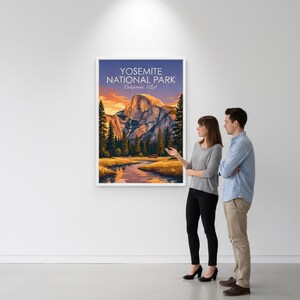 May include: A framed print of Yosemite National Park, California, USA. The artwork depicts a scenic landscape with a river, mountains, and trees under a sunset sky. The print is displayed on a white wall.