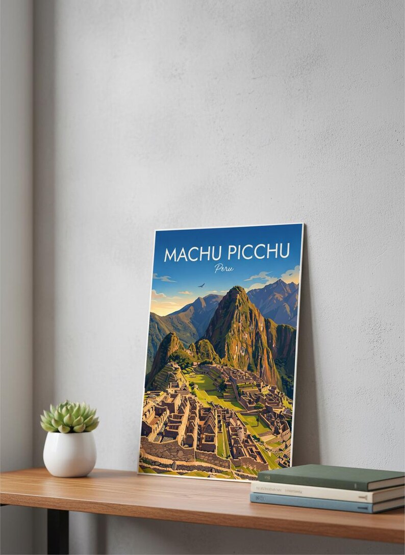 May include: A framed print of Machu Picchu, Peru, featuring a detailed illustration of the ancient city nestled in the mountains. The print has a blue sky background with the text "Machu Picchu Peru". The print is displayed on a wooden surface.