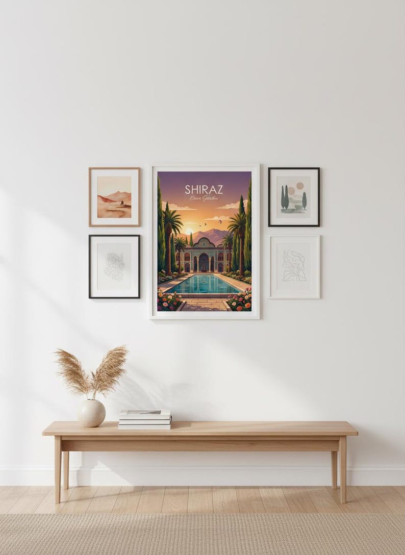 May include: A wall display featuring framed art prints and a wooden bench. The central piece is a framed poster with the text "Shiraz Eram Garden" depicting a Persian garden scene with a pool and palm trees. Other frames contain abstract and landscape art.