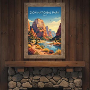 May include: A framed wall art print featuring a stylized illustration of Zion National Park, Utah. The image depicts towering red rock cliffs, a winding blue river, and desert vegetation under a clear sky with the text Zion National Park Utah.