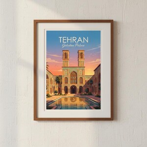 May include: Framed art print featuring the Golestan Palace in Tehran, Iran. The image showcases the palace with its two towers, a reflecting pool, and palm trees, set against a sunset sky. The text "TEHRAN Golestan Palace" is displayed at the top.