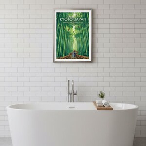 May include: Framed print featuring a vibrant depiction of the Arashiyama Bamboo Grove in Kyoto, Japan. The artwork showcases a path winding through towering green bamboo stalks, with the text "KYOTO, JAPAN" at the top.