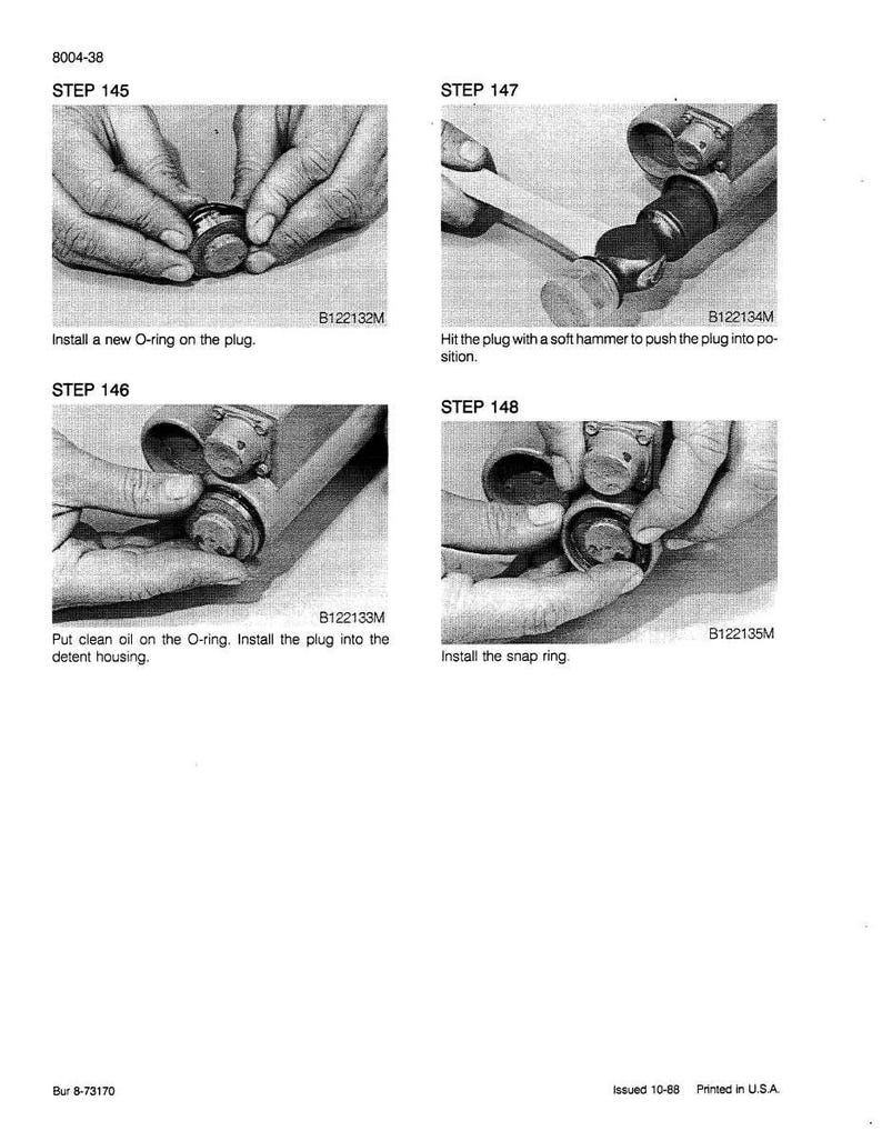May include: A technical diagram with four steps for mechanical assembly. The steps include installing an O-ring, applying oil, hammering a plug, and installing a snap ring. Text in the image provides instructions.