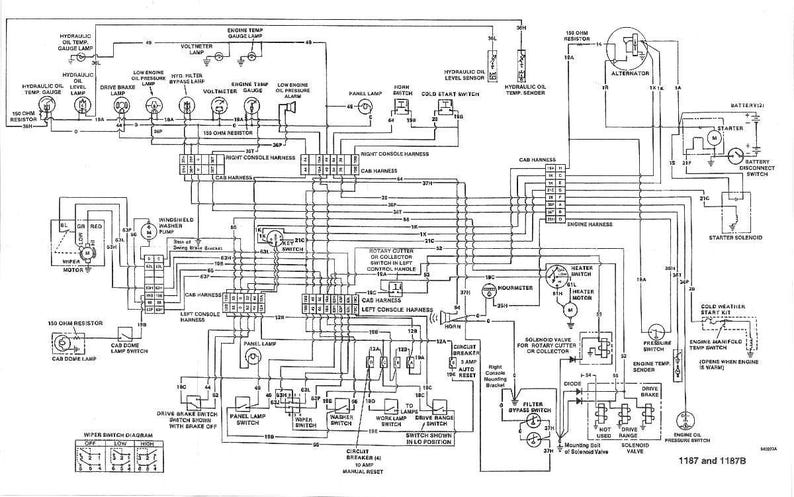 May include: A detailed black and white schematic diagram of an electrical system, featuring numerous interconnected components, labels, and wiring. Includes text such as "Hydraulic Oil Temp Gauge Lamp" and "Engine Temp Gauge Lamp".