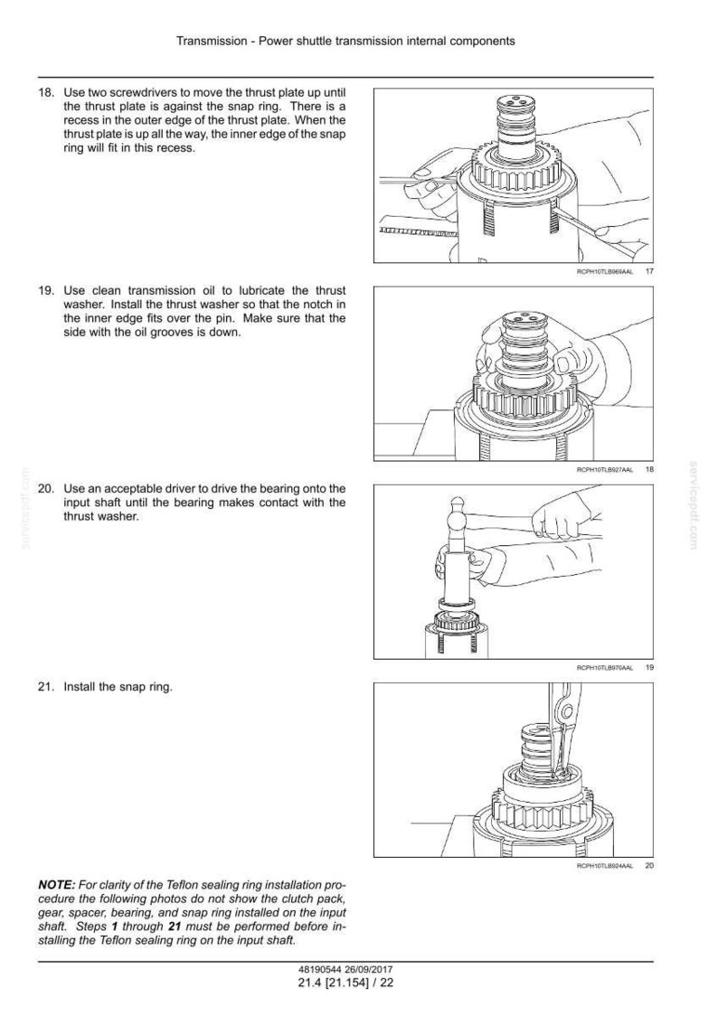 May include: Diagrams illustrating the assembly of a power shuttle transmission. The images show the use of tools like screwdrivers and drivers to install components such as thrust plates, washers, and snap rings. The text provides step-by-step instructions.