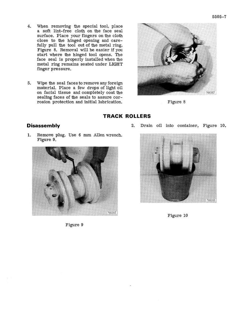 May include: Black and white technical manual page with instructions for track roller disassembly. Includes diagrams of hands using tools and components, with text and figure numbers.