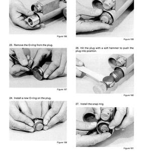 May include: A black and white diagram with instructions for mechanical assembly. Text includes steps for installing a spacer, removing and installing O-rings, and installing a snap ring. Figures 156-161 are shown.
