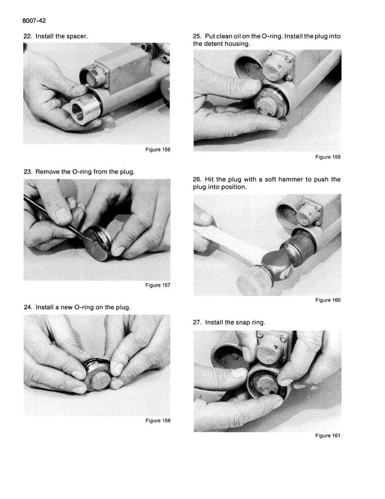 May include: A black and white diagram with instructions for mechanical assembly. Text includes steps for installing a spacer, removing and installing O-rings, and installing a snap ring. Figures 156-161 are shown.
