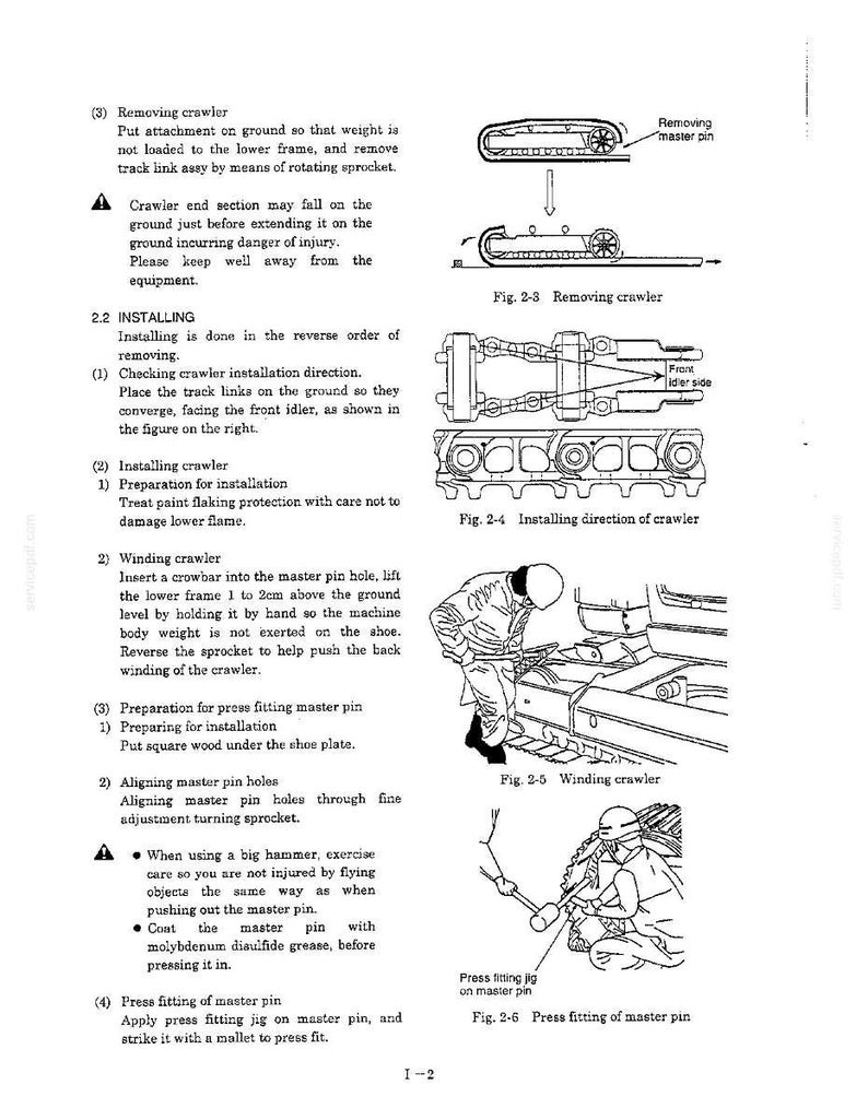May include: A technical manual page titled 1-2 detailing the removal and installation of a crawler track. It features black and white line drawings showing the master pin, track links, idler, and a person using tools to wind and press fit the pin.