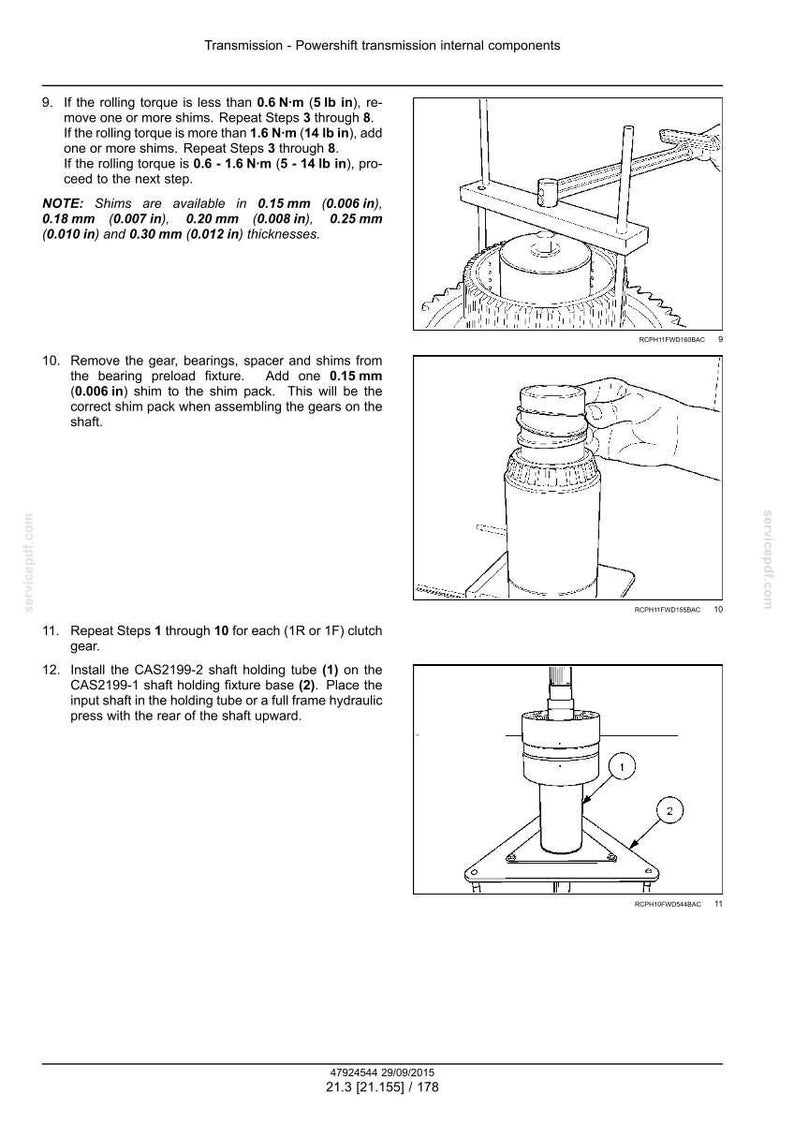 May include: Diagram of transmission components with text instructions. Includes images of tools and parts, such as a shaft holding tube and fixture base. Text details shim measurements in inches and torque specifications.