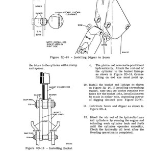 May include: Technical diagram illustrating the installation of a dipper to a boom and the installation of a bucket. The diagram includes labels for various components such as shims, washers, and pins, with detailed instructions.