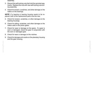 May include: A white document with the title "Wheel hub - Inspect" and numbered instructions for inspecting a rear axle system. The document includes steps for cleaning parts, replacing seals and nuts, and checking for damage.