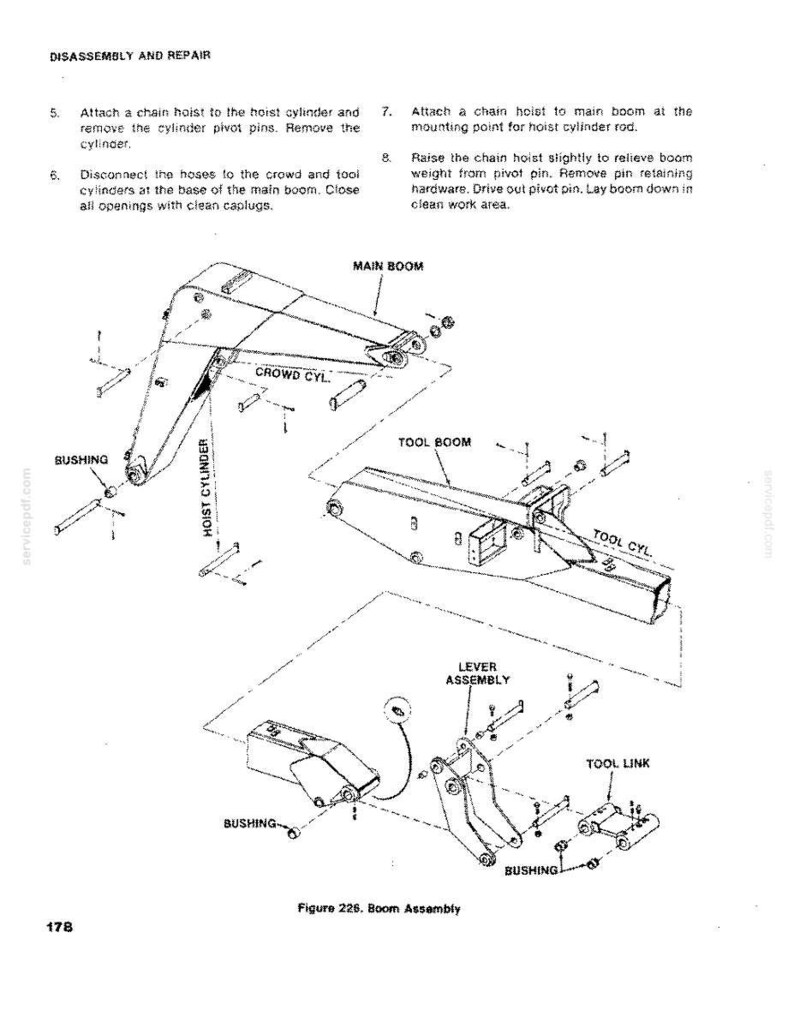 May include: An exploded diagram of a boom assembly, with labels for various components like the main boom, tool boom, and cylinders. The diagram includes instructions for disassembly and repair, with callouts for bushings and pivot pins.