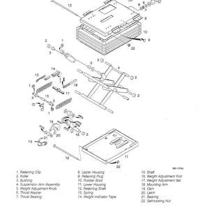 May include: An exploded diagram of mechanical components, including springs, shafts, and housings. The image is a black and white technical illustration with labels identifying each part. The diagram is labeled 9063-10.