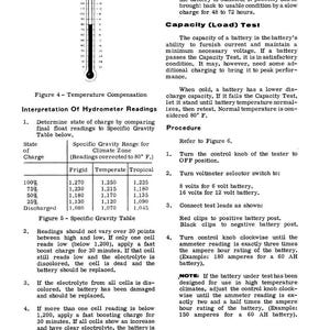 May include: A page from a manual with text and diagrams about battery testing. It includes a hydrometer reading chart, a temperature compensation chart, and instructions for a capacity (load) test. The text is in black font.