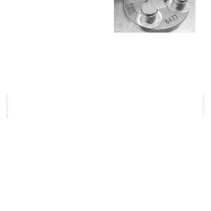 May include: A grayscale image of an upper structure component. The component has a circular base with several cylindrical protrusions and a central toothed gear. The number "8477" is visible. The text "33. UPPER STRUCTURE" is at the top.