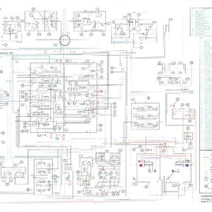 May include: A detailed schematic diagram for a CX460 excavator, featuring hydraulic and electric components. The diagram is filled with lines, symbols, and text, with a key on the right side. The overall color scheme is black, red, and blue on a white background.