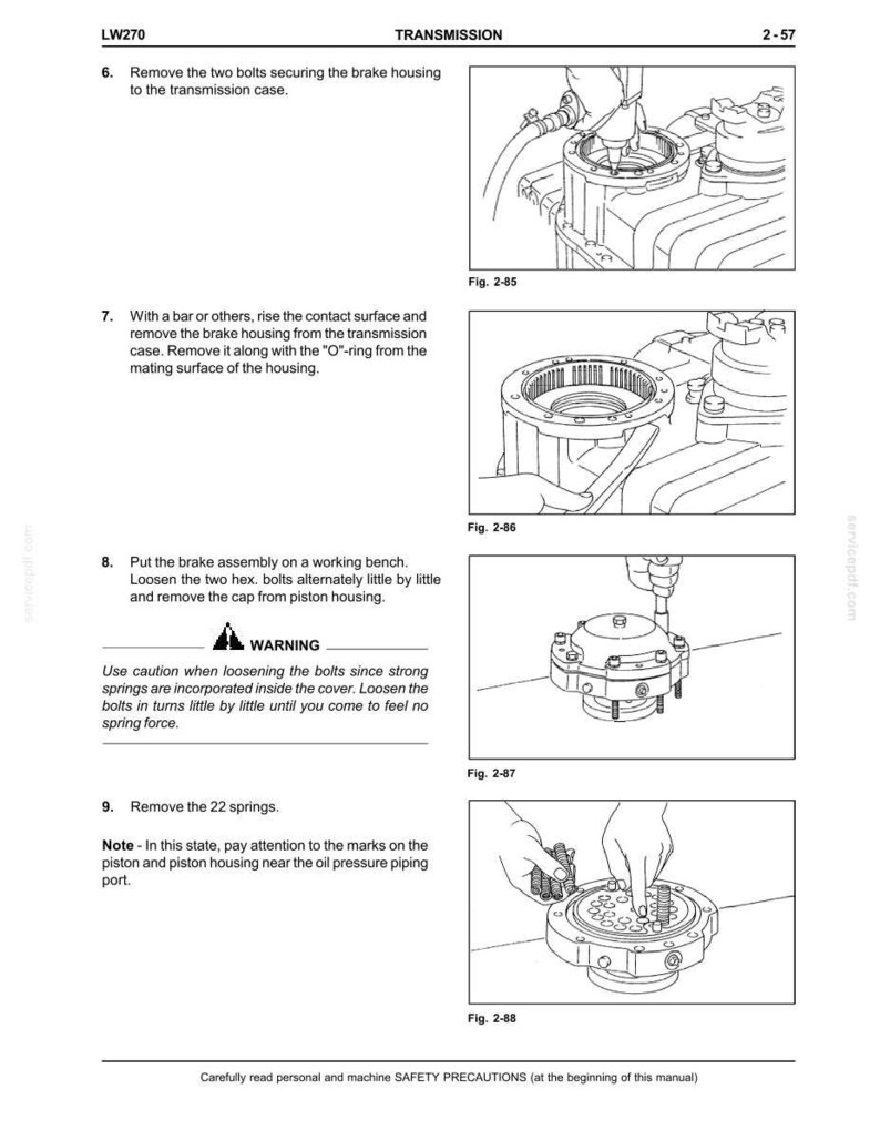 May include: Technical manual page with diagrams illustrating transmission component disassembly. Includes text instructions for removing bolts, housings, and springs. Features warnings about spring force and safety precautions.