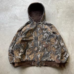 Sudadera con capucha y cremallera estilo camuflaje Mossy Oak vintage, fabricada en EE. UU., con forro polar, talla XL. imagen 1