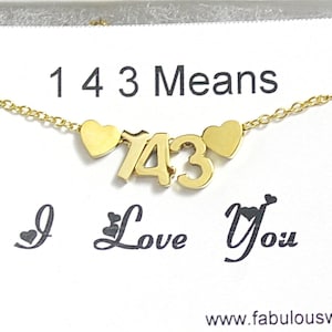 May include: Gold necklace with a charm that says "143" with hearts on either side. The card says "143 Means I Love You" and "www.fabulouswire.com".