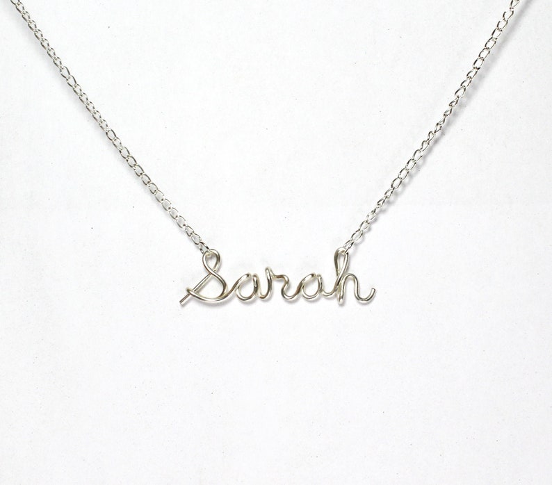 18-Inch Rhodium Plated Necklace with 4mm Light Amethyst Birthstone Beads and Sterling Silver Saint Joachim Charm.