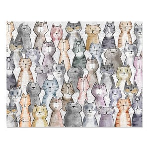 May include: A jigsaw puzzle featuring a watercolor illustration of numerous stylized cats in various colors, including gray, orange, and pink. The cats are arranged closely together, creating a whimsical and artistic design.