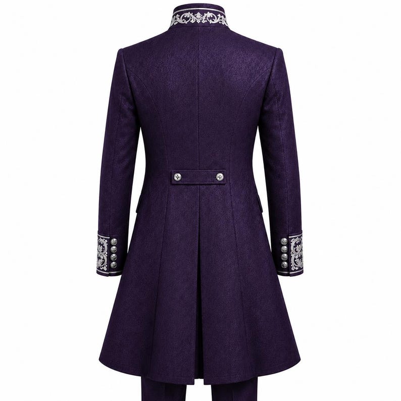 May include: A long, deep purple coat featuring a high collar with intricate silver embroidery. The cuffs also display matching silver embroidery and four silver buttons. A horizontal back tab with two silver buttons sits above a central vent.