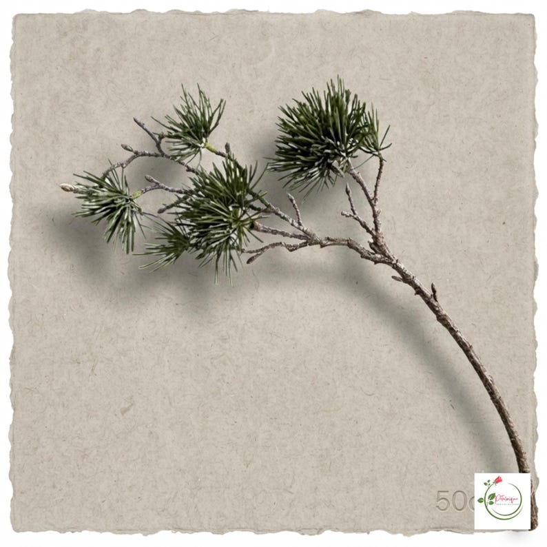 Artificial greenery arranged with white flowers